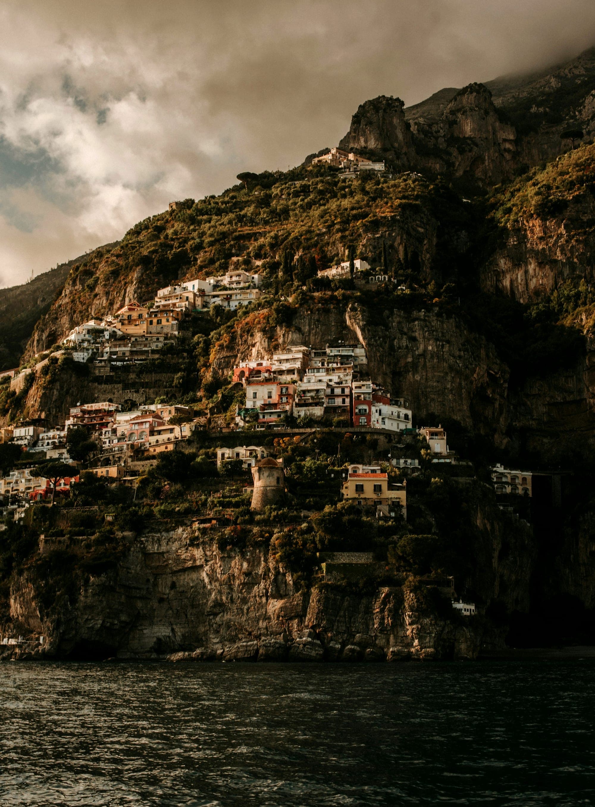 Pastel cliffside houses tumbling toward the Mediterranean Sea